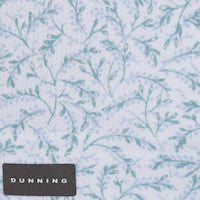Textile with floral pattern and Dunning label on a light blue background