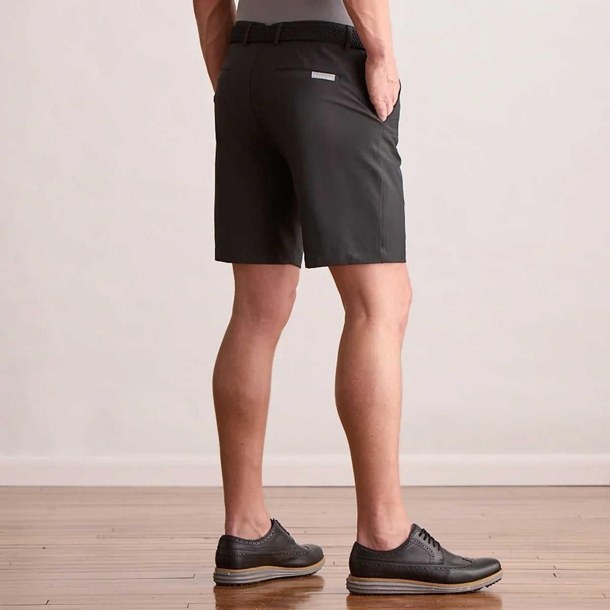 Player Fit Woven 9" Short in black, back view on model
