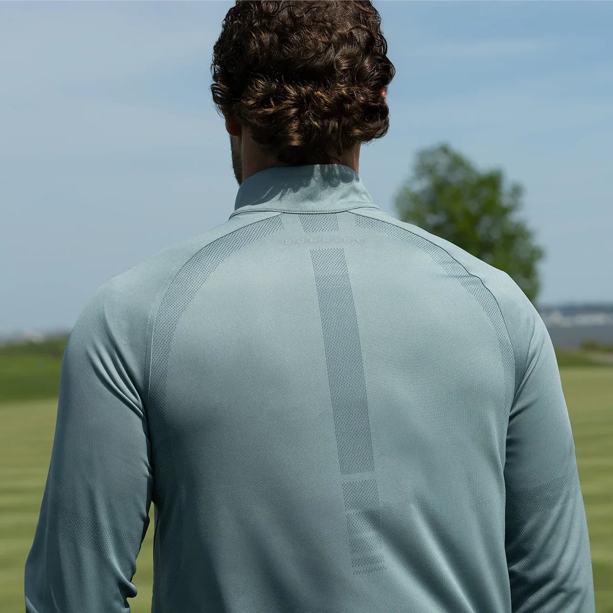 Quest Contour Quarter Zip in Slate Green, worn by a model, back view