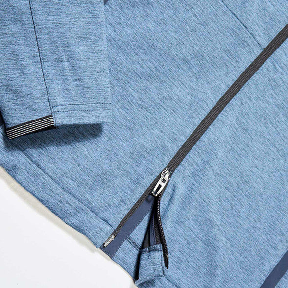 Close-up of a blue jacket with a zipper on a white background
