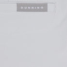 Close-up of a gray fabric with 'Dunning' branding label.