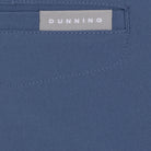 Close-up of a blue fabric with a 'Dunning' label.