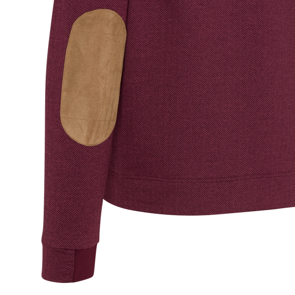 Close-up of a maroon garment with a brown patch on a white background