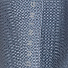Close-up of a blue denim fabric with 'Quiksilver' branding.