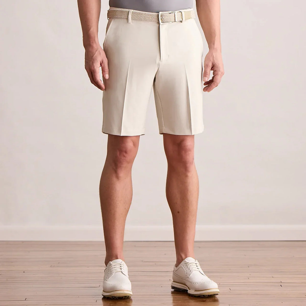 Player Fit Woven 9" Short in stone, front view on model