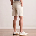 Player Fit Woven 9" Short in stone, back view on model