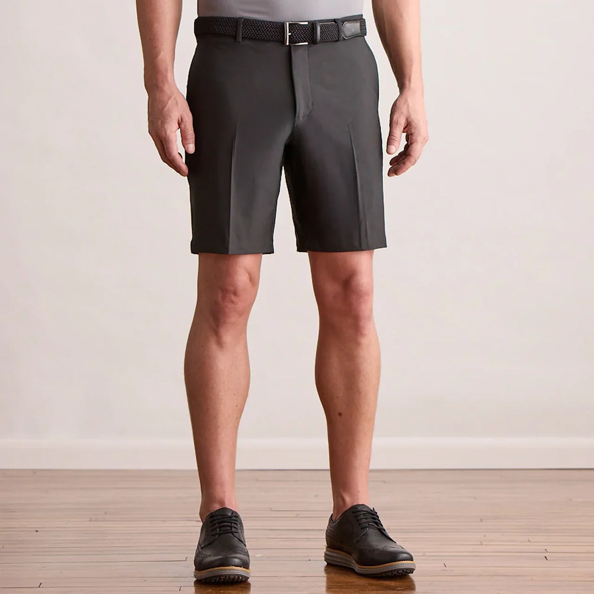 Player Fit Woven 9" Short in black, front view on model
