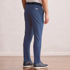 Modern Player Fit Performance Pant in vintage indigo, back view on model