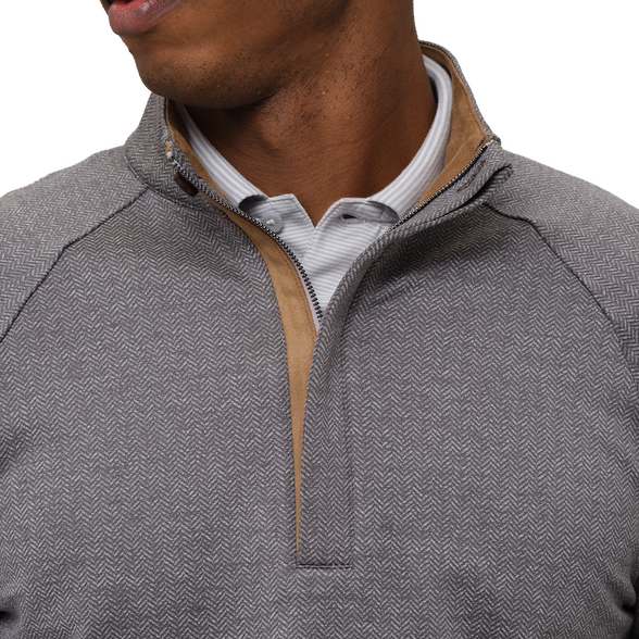 Gray quarter-zip sweater with brown trim worn by a person