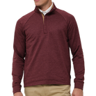 Maroon long-sleeve shirt worn by a person on a white background