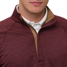 Maroon half-zip sweater with brown zipper and white shirt underneath on a white background